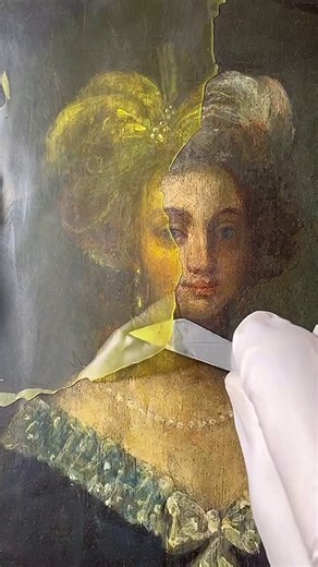 Removing protective restoration wax from an antique painting.