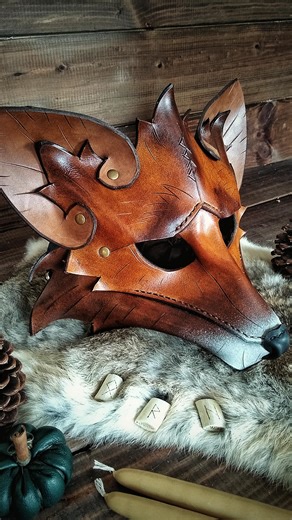 I love helping people try on my handmade leather masks at Renaissance Faires! They can be worn over the face or on top of the head for a little variation. Will I see you this weekend at the New Hampshire Ren Faire? All of my animal masks are able to be dyed any color and engraved with the custom runes of your choice. You can check them out on my website🦊 #leather #leatherwork #leathercraft #fantasy #renfaire #renfest #larp #wearableart #cottagecore #fantasycore #witchy #runes | Embercraft Creat