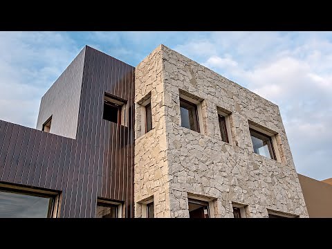 Arquitectura. Casa moderna con revestimiento en piedra. Diseño con piedra natural en interiores.