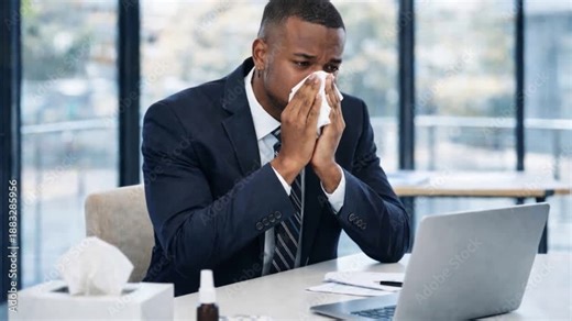 Man flu and blowing nose with tissue in office for virus, hayfever or sinus allergies.