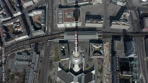 AERIAL: Breathtaking Overhead Aerial Flight Over Alexander Platz TV Tower in Empty Berlin, Germany with almost no People or Cars on Beautiful Sunny Day