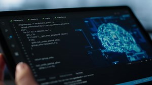 Data center technician using artificial intelligence on tablet to prevent vulnerabilities. Employee using device to review firewall rules, enforcing AI cybersecurity protocols, camera A close up
