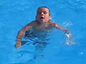 Kid swims in the pool underwater!