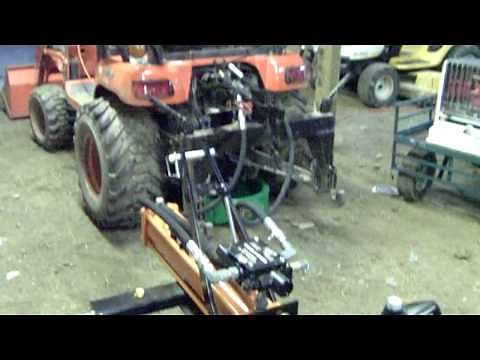 Harbor Freight 3-point log splitter attached to a Kubota BX-24
