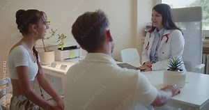 Young couple consulting a doctor. They are sitting at the office and receiving treatment and appropriate therapy.