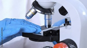 Scientist using laboratory microscope. Doctor using medicine microscope in the clinical laboratory. Scientist using microscope for study research in science laboratory. Stock Video