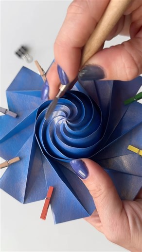 Ekaterina Lukasheva on Instagram: "Folding one spiral is usually easier than collapsing many spirals at once. Very fun and mess-free process! #doityourselfproject #paper #paperfolding #blueart"