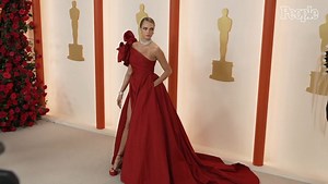 Cara Delevingne Makes Her Oscars Red Carpet Debut in a Daring Gown with a Thigh-High Slit