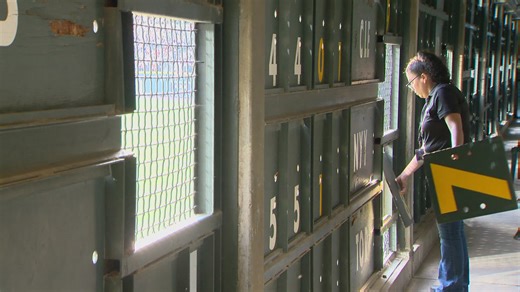 A behind the scenes look at the manual scoreboard in Coors Field