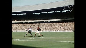 Sixty years after the career of one of Australian Rules football's greatest players came to a sudden end, rare footage of Essendon champion John Coleman was re-discovered, preserved and released by the NFSA. This silent colour 16mm film of action at the Melbourne Cricket Ground from the 1953 Victorian Football League (VFL) First Semi Final between Footscray and Essendon features the forward contesting marks against perhaps his toughest opponent, Footscray Full Back Herb Henderson. See more Melbo
