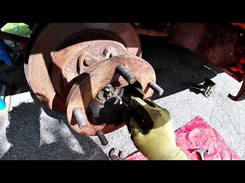 Removing a rotor and hub assembly from a Chev P30 motorhome.
