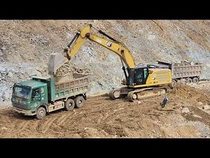Heavy machines at work – CAT & Komatsu digging deep at the construction site. #1