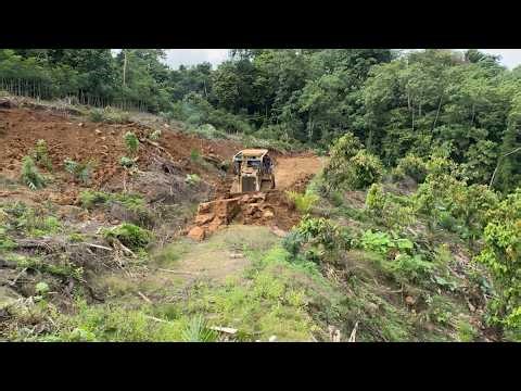 The CAT D6R XL Bulldozer Operator Skillfully Builds Mountain Terraces Quickly on Steep Slopes