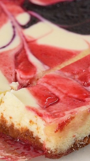 These festive cheesecake bars are the ultimate make-ahead dessert for summertime celebrations. 🎉 Get the recipe: https://bit.ly/3JAKNSz | Southern Living