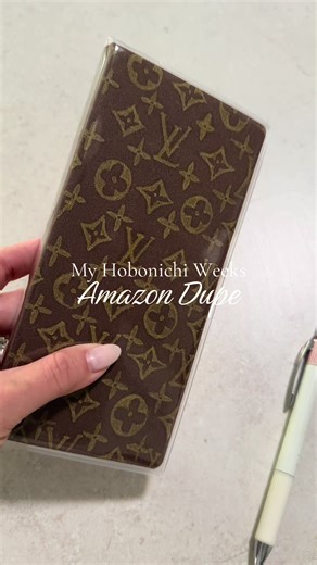I bought this $11ish undated #hibonichiweeks planner off of #amazon to test out this planner layout and size before I commit to the real deal. Needless to say I’m obsessed with it. 🤎 I doodled the #louisvuitton pattern on the front just for fun with a gold pen and personalized the front and back with my own vision boards and goals. I can’t wait to invest in the real one for 2027 so I have more extra note pages to work with. But for now- I’m super happy with it! #plannertok #planneraddict