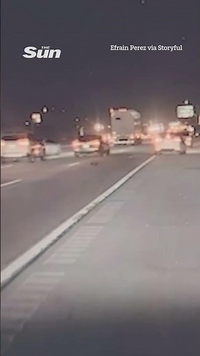 Moment truck flies off overpass in dramatic freeway crash