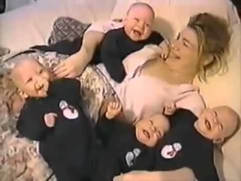 Quadruplets laughing with Mom