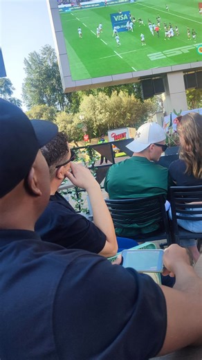 1.6K views · 117 reactions | Tony Ndoro proves that men CAN multitask! The HOT1027 Drive Team joined hundreds of HOT1027 listeners at Montecasino’s Piazza on Saturday to watch the Springboks 29-27 victory over Los Pumas. Arsenal was playing at the same time… but Tony made sure he could support BOTH his teams. #hot1027 #hot1027drive | HOT 102.7 FM | Facebook