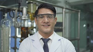 A portrait of scientist man smiling in lab or laboratory in technology medical, chemistry, healthcare, research. Experimental science. People lifestyle.