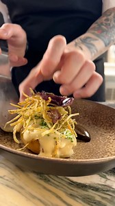 How we make our Baked Potato with Cheese Sauce! 🧀We begin by slowly poaching Cyprus potatoes in butter until tender. This is topped with a liquid cheese sauce, shoestring fries, and pickled dulse. Served with walnut ketchup and a kombu butter emulsion. 👌.....#LondonFoodies #LondonDiningScene #LondonRestaurants | Roe Restaurant