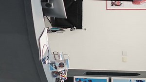 Vertical video: Empty clinic with counter and wheelchair in hospital reception area, front desk with registration forms for medical appointments. Disability friendly diagnostic center with reports