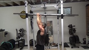 Two Angled Bar Neutral Grip Pull-Ups - this a great setup if you don't have neutral grip handles on your pull-up station in your gym or at home. Neutral grip is easier on the shoulders when doing chin-ups / pull-ups. I've got 2 Olympic bars set up on the rails of my power rack, about shoulder-width apart. You can go wider if you want to get your shoulders higher during the pull. The bars are a bit angled (one end higher) so that my pinkies are higher - this isn't 100% necessary but I do find the