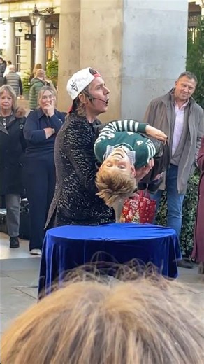 Street magician in london makes kid float