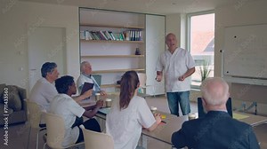 doctor colleagues following medical seminar in hospital meeting room