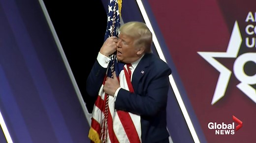 President Trump hugs, gives kiss to American flag at CPAC Conference