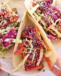 Recipe here: https://www.eatingbirdfood.com/crunchy-asian-slaw/ This quick and easy Asian slaw is loaded with crunchy vegetables and tossed in a flavorful sesame soy Asian dressing. Perfect as a topping for tacos or as a side! | Eating Bird Food