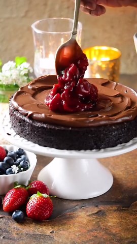 Flourless Dark Chocolate Gateau with roasted vanilla berries