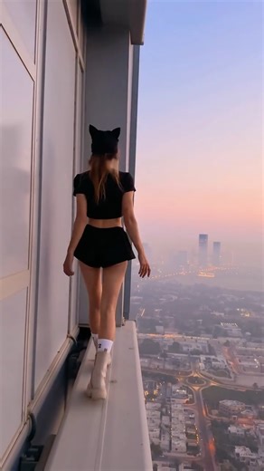 A N G E L A N I K O L A U on Instagram: "You see a beautiful frame. But you don’t see Vanya @beerkus hanging on a ladder over the edge — one hand holding on, the other filming. Yes, this is exactly how it’s shot. We always film everything ourselves. If a cameraman is filming us from below with a drone — it’s not our work. That’s our genre in contemporary art. Extreme. On the edge. But honest."