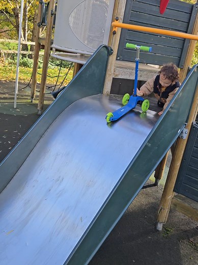 Kids Having Fun on a Playground Slide