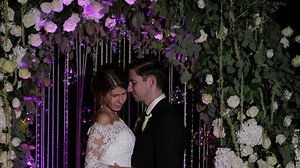 Happy loving couple kissing in twilight time. Wedding ceremony