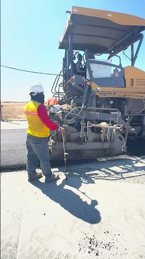 Laying asphalt road.