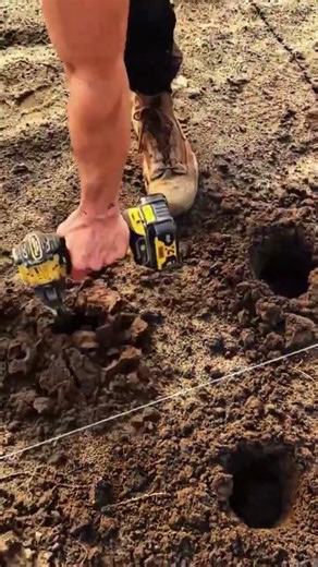 the process of drilling holes in the ground using a drill #construction #drilling #ground #shorts