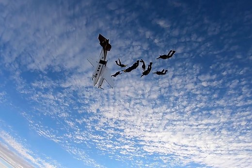 Aircraft stalls and spirals out of control as sky divers jump