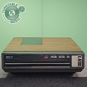 It plays a vinyl disc with a stylus mounted on a linear tracking pickup arm. But instead of audio, it plays video! This is the 1981 RCA Selectavision. Basically, a record that plays video! And so, so close to being a turntable that I've shared it here for you. #selectavision #rca #ced #videodisc | Turntable Medic