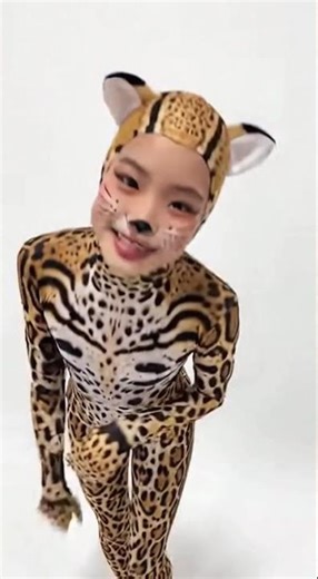 A teenager girl wears ocelot animal lycra spandex costume.