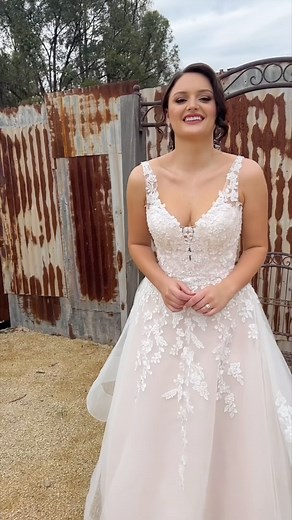 For the bride dreaming of a rustic romance—meet Trixie from Gilded Rose. 🌸 With a statement skirt, soft blush tones, and intricate beaded floral appliqué, this gown is the perfect blend of whimsical and elegant. Planning a countryside or garden wedding? This could be the one! Book your appointment to try it on today. #GildedRoseBridal #JeanFoxBridalCollective #RusticWedding #BlushWeddingGown #SydneyBrides #CastleHillBridal | Jean Fox Bridal Collective