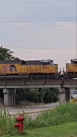 Union Pacific grain train with a SD70ACE-T4 trailing 2nd