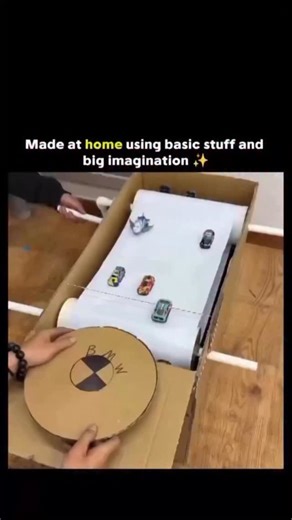 Circuit Sphere on Instagram: "The post features a short video demonstrating a DIY cardboard slot car racing “console” built from household materials like a box, paper, and toy cars, showcasing simple mechanics to simulate a spinning track via a hand-cranked wheel. High engagement (over 37,000 likes) stems from its nostalgic appeal to 1980s toys like Tomy Turbo Dashboard, as echoed in replies, highlighting creativity in low-cost entertainment amid modern gaming trends. This project illustrates ba