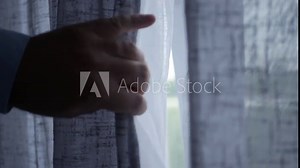 Spying from Behind the Curtain, Pulls the Drapes Looking Thru the Window. One Person Looking Outside Back from the Window Curtain.