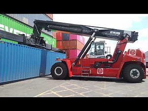 Kalmar Reach stacker with a tilting spreader for container handling.....