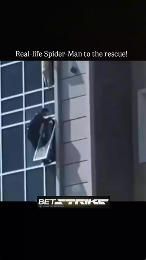 TheRescueHero on Instagram: "This intense footage shows a toddler hanging precariously from a high-rise window ledge. A heroic bystander climbs out of a lower window, scales the side of the building with no safety gear, and manages to catch the child just as they lose their grip. The man safely pulls the child into an open window, narrowly avoiding a tragedy.#hero #miracle #realifehero #bravery #humanity"