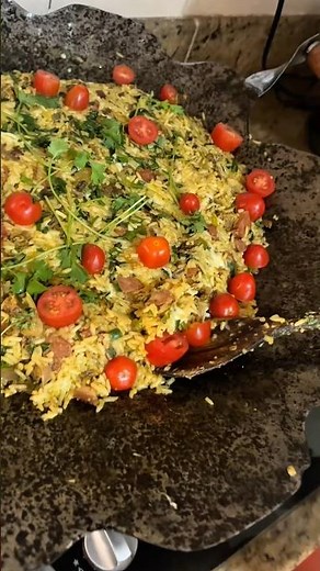 Rice cooked on a plow disc.