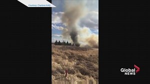 A fire tornado formed just north of Edmonton Thursday as crews battled an intense grass fire. It forced one St. Albert Fire Services member into the water to save himself from the flames and ash. READ MORE: http://bit.ly/264TcTM | Global Calgary