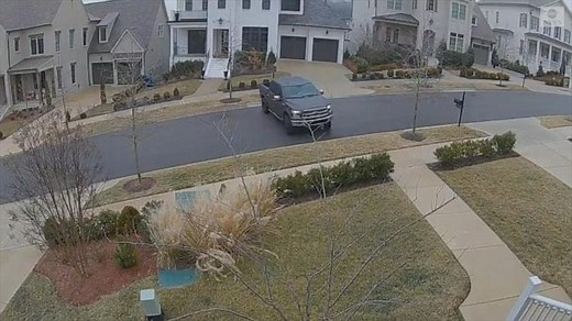 Pickup truck slides down icy street in Tennessee