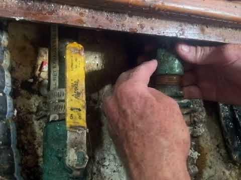 Packing a sailboat stuffing box while the boat is in the water.