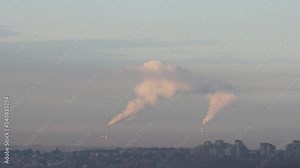Power plants chimneys with steam belching from high gas smokestack
